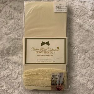 cream leggings / stockings with frills